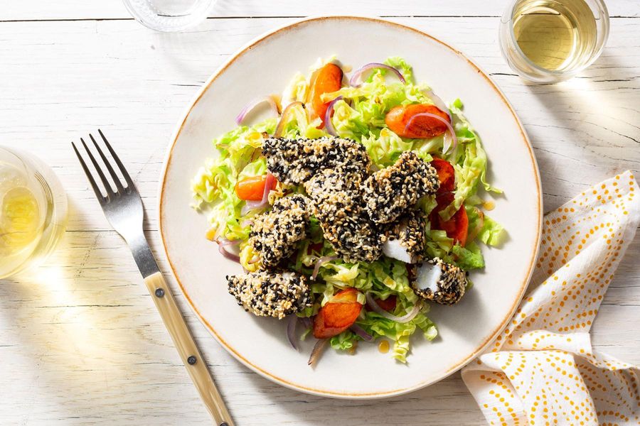 Sesame-crusted fish nuggets with orange-glazed vegetables