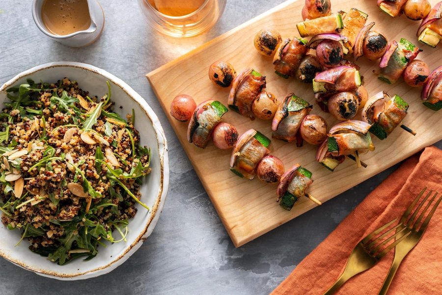 Prosciutto, squash, and grape skewers with quinoa-arugula salad