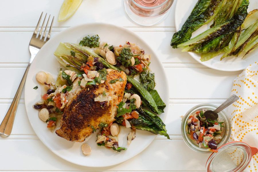 Harissa-rubbed chicken with artichoke tapenade and seared romaine