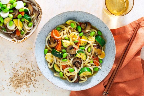 Japanese curry udon with carrots, mushrooms, and edamame