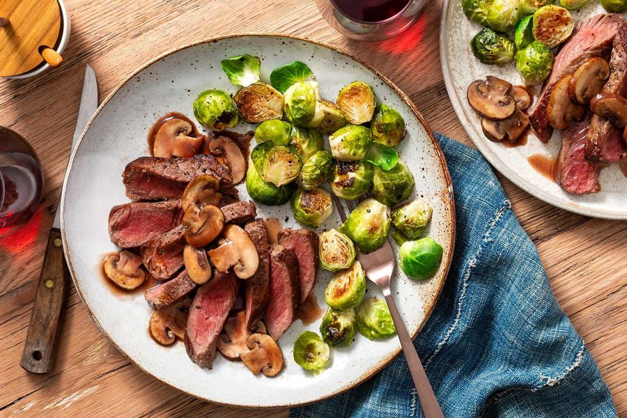 Steaks with mushroom pan sauce and Brussels sprouts