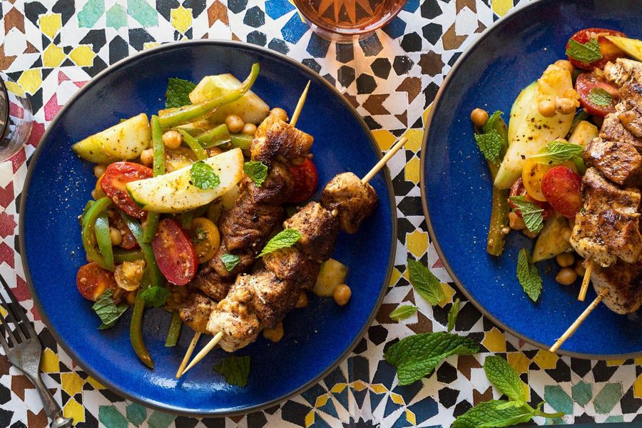 Moroccan-spiced chicken skewers with pepper and tomato salad