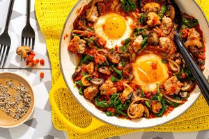 Eggs in purgatory on spicy turkey, mushroom, and kale hash