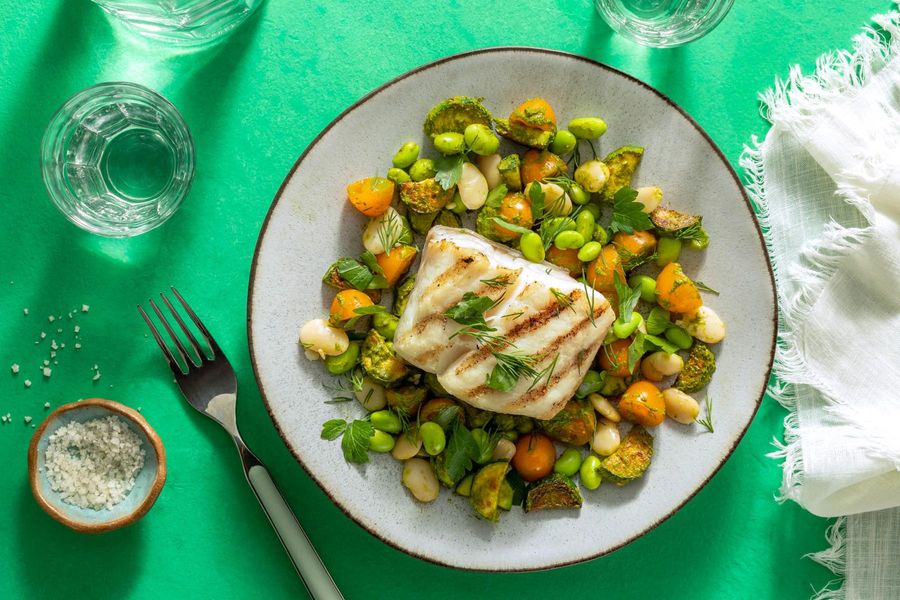 Seared halibut over butter bean, edamame, and tomatillo succotash