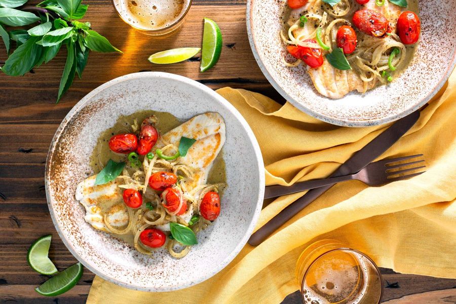 Indian coconut curry with pan-seared sole, tomatoes, and fresh basil