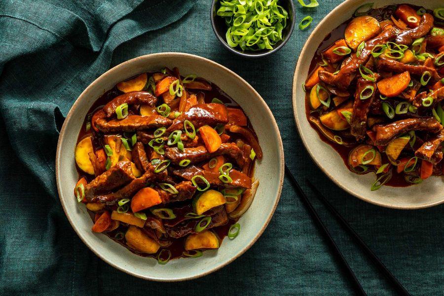 Steak and vegetable stir-fry with cashew-plum sauce
