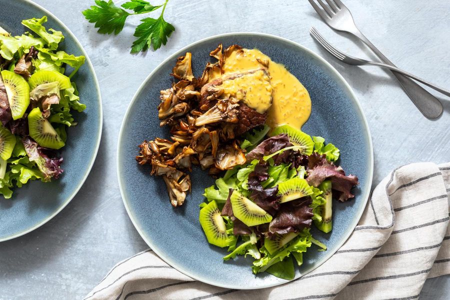 Filet mignons with mustard pan sauce and kiwi salad