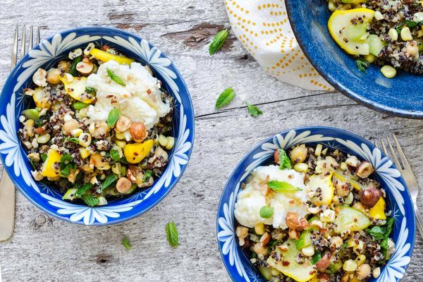 Warm quinoa and corn salad with summer squash, ricotta, and hazelnuts