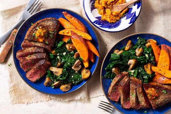 Steak and sweet potato frites with kale and mushrooms