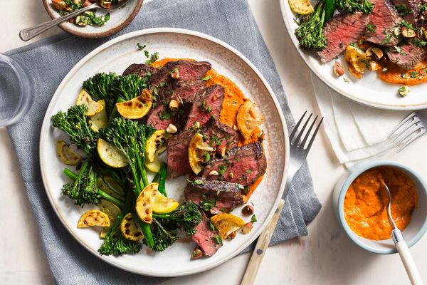 Seared steak with lemon-almond relish, broccoli, and romesco