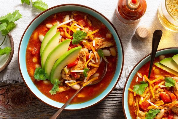 Quick chicken and white bean chili with avocado and cheese