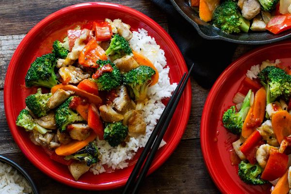 Orange chicken and vegetable stir-fry with jasmine rice
