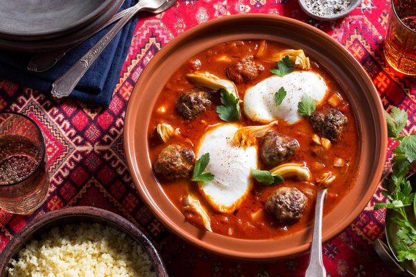 Moroccan lamb tagine with artichokes, tomato-poached eggs, and couscous