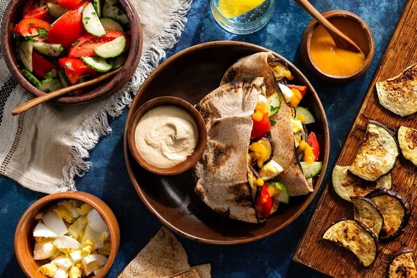 Middle Eastern eggplant pitas with spicy amba sauce and cucumber salad