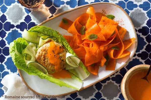 Lettuce-wrapped turkey burgers with chraime-spiced carrot salad