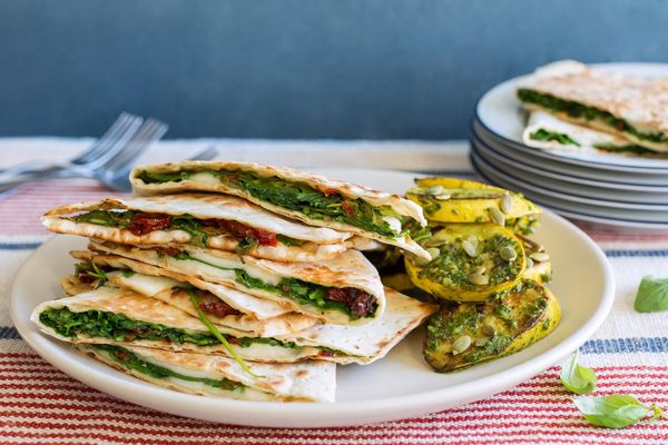 Spinach-mozzarella panini with seared summer squash and arugula pesto
