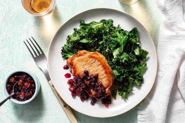 Blueberry-apricot pork chops with sautéed kale