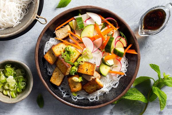 Saigon noodle bowls with braised tofu and cucumber-radish salad