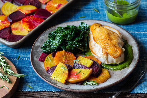 Chicken breasts and parsley-pecan pesto with roasted beets and oranges