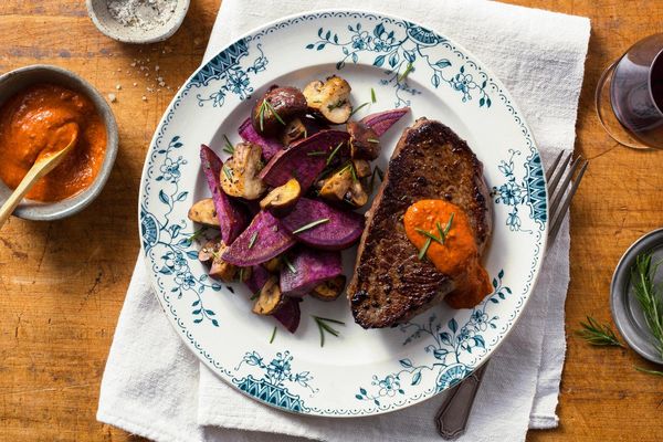 Steak with purple sweet potatoes and roasted red pepper salsa