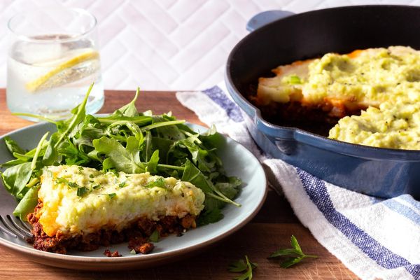 Lamb moussaka with potatoes, skordalia, and arugula salad
