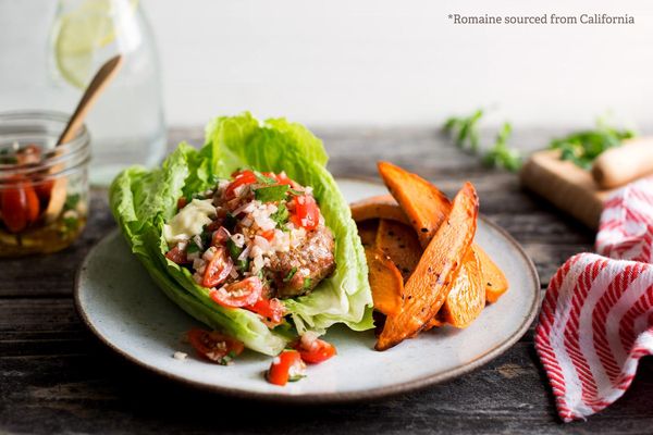 Lettuce-wrapped turkey burgers with tomato relish and sweet potato fries