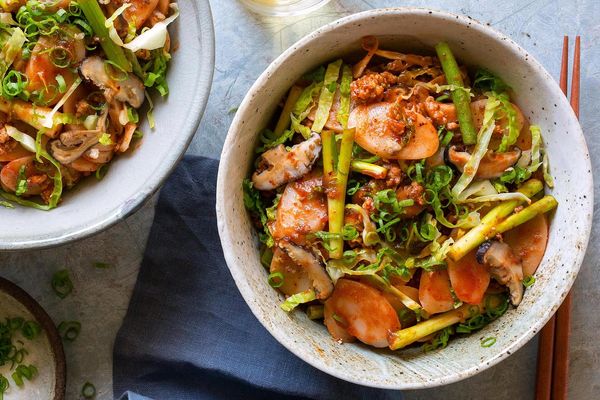 Korean tteokbokki rice cake stir-fry with pork and shiitake mushrooms