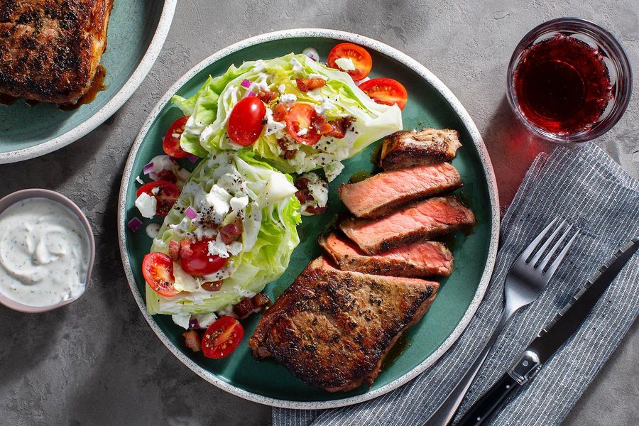 Black Angus steaks with wedge salad, crispy pancetta, and ranch dressing