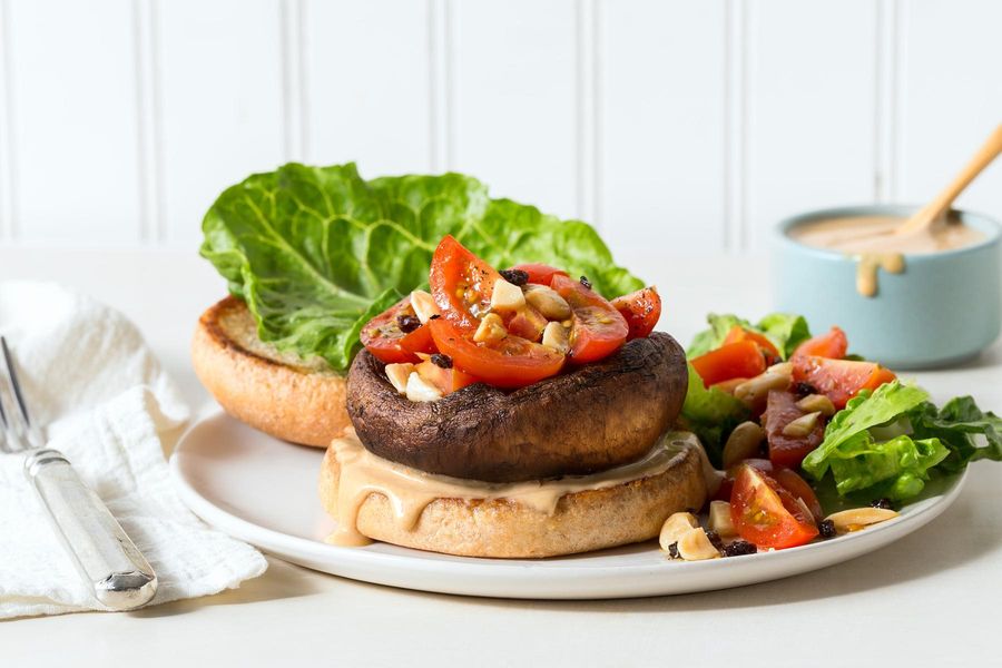 Portobello burgers with vegan Caesar dressing and tomato-almond salad