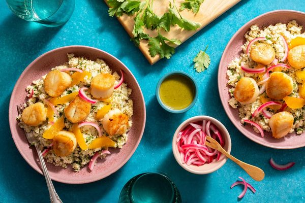 Peruvian chicken over orange–cauliflower “rice” with ají verde
