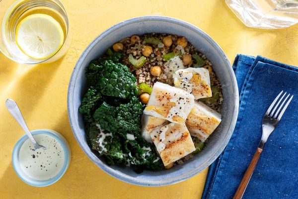 Salmon and quinoa bowls with wilted greens and citrus dressing