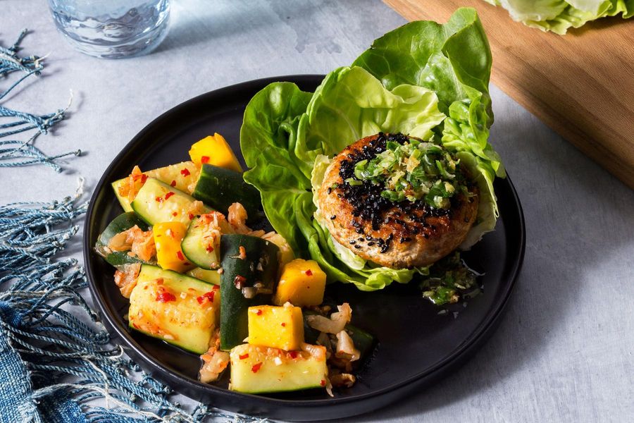 Salmon burgers with black sesame seeds and cucumber kimchi smash image