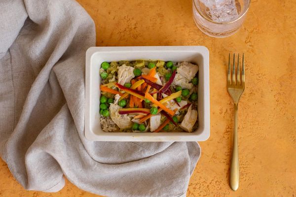 Garlicky chicken and brown rice with carrots and sweet peas