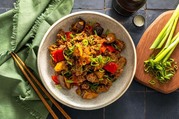 Five-spice pork and eggplant stir-fry with cashew-plum sauce