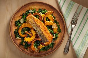 Salmon with roasted delicata squash, wilted kale, and raisins