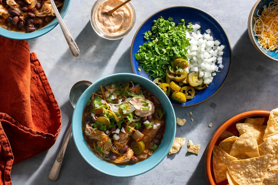 Chicken and black bean tortilla soup with spicy chipotle yogurt