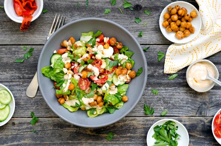 Chopped romaine salad with Piquillo peppers, hazelnuts and fried chickpeas