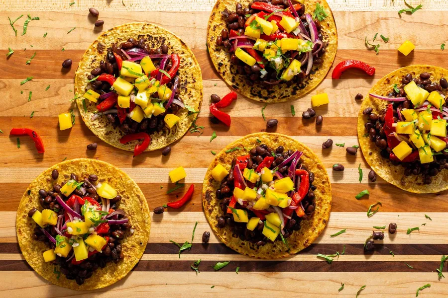 Spicy black bean tacos with mango salsa and peperonata