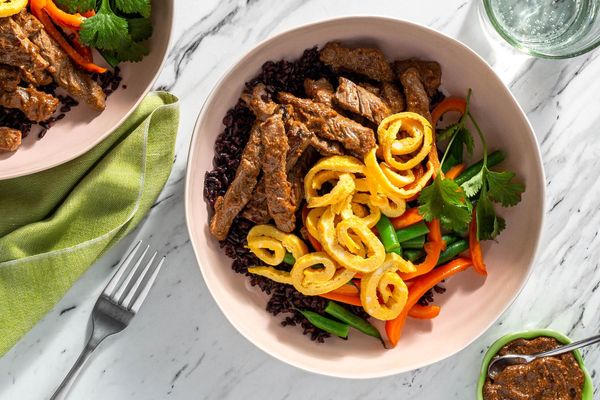Tamarind chicken over black rice with bell pepper and egg ribbons