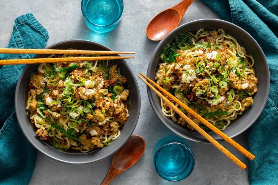 Taiwanese noodle soup with baby greens and your choice of protein