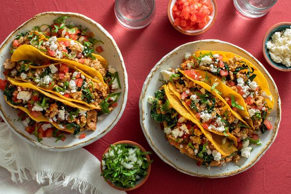 Street tacos with kale, tomato, and queso fresco