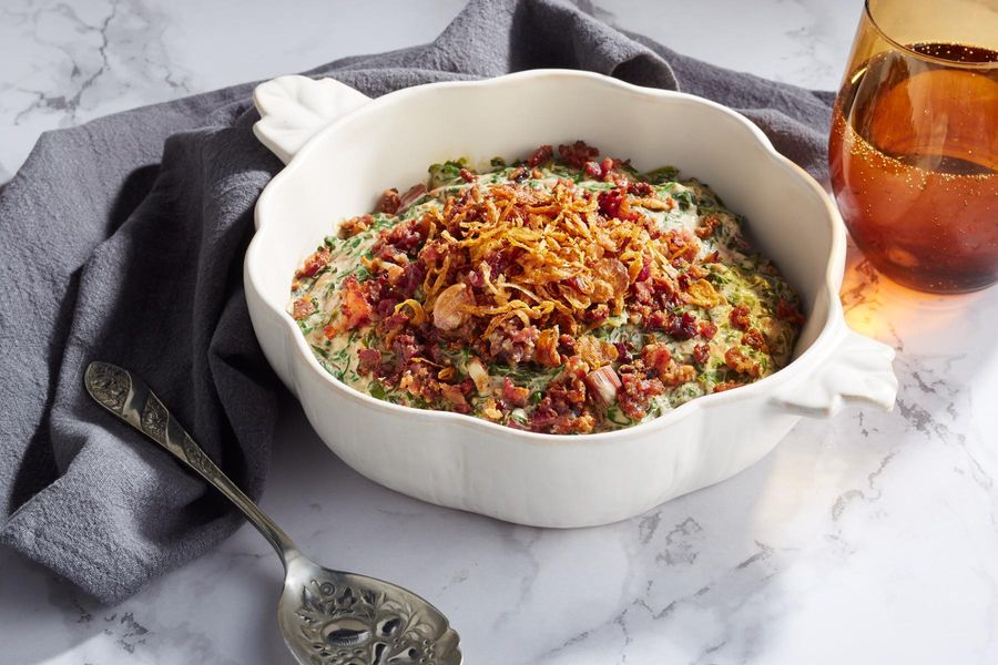 Creamed greens with bacon and fried shallots