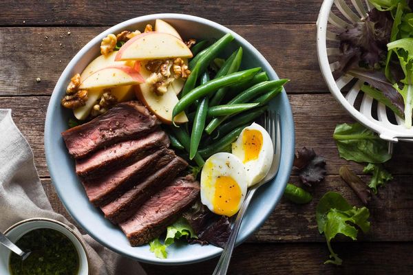 Steak salad with apples, green beans, and soft-cooked eggs