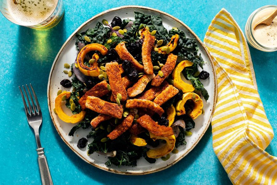 Harissa-spiced pork and kale salad with squash and dried cherries
