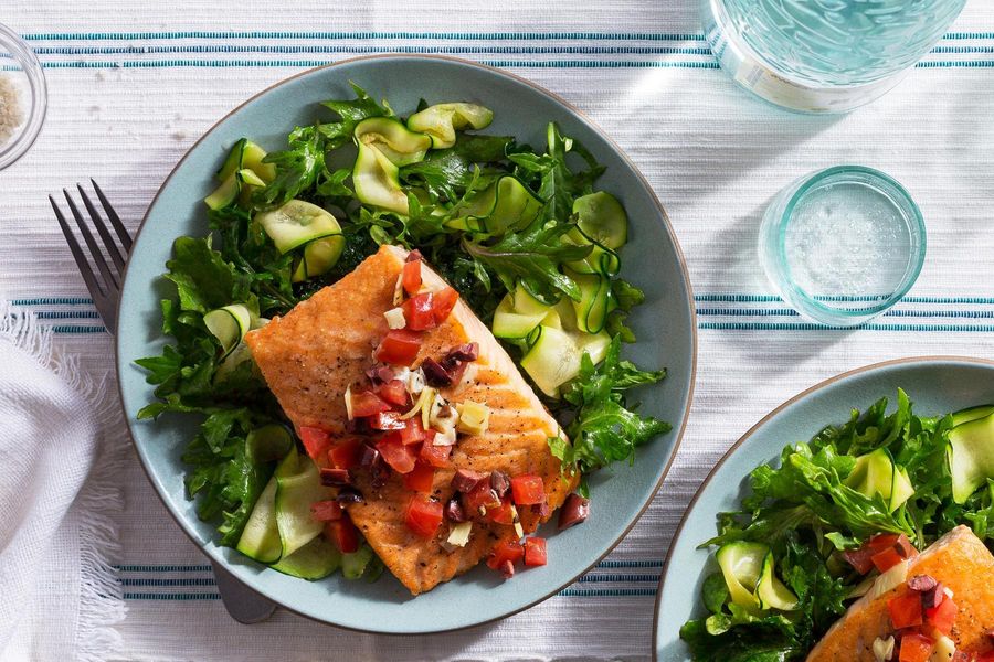Greek-style salmon over zucchini noodles and wilted greens