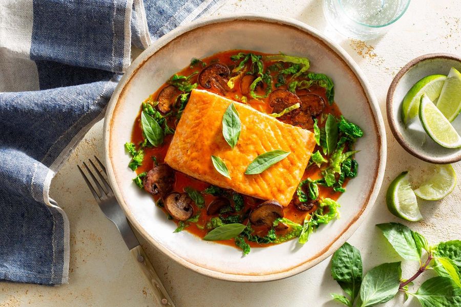 Thai-style salmon in spicy red curry with fresh basil