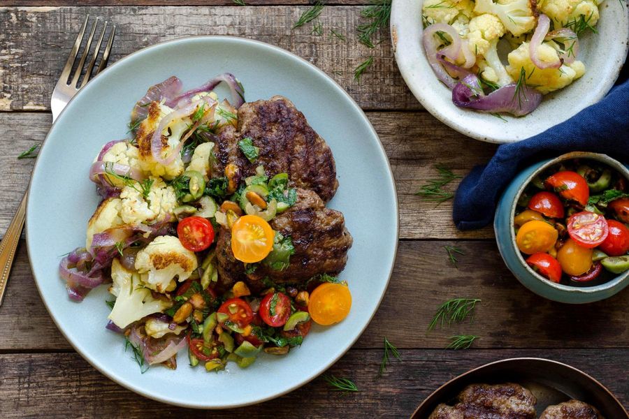 Middle Eastern sausage patties with tomato-pistachio relish