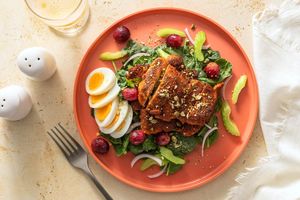 Middle Eastern chicken and spinach salad with warm grapes and dukkah