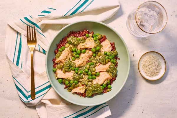 Salmon mole verde with red rice, sweet peas, and pumpkin seeds