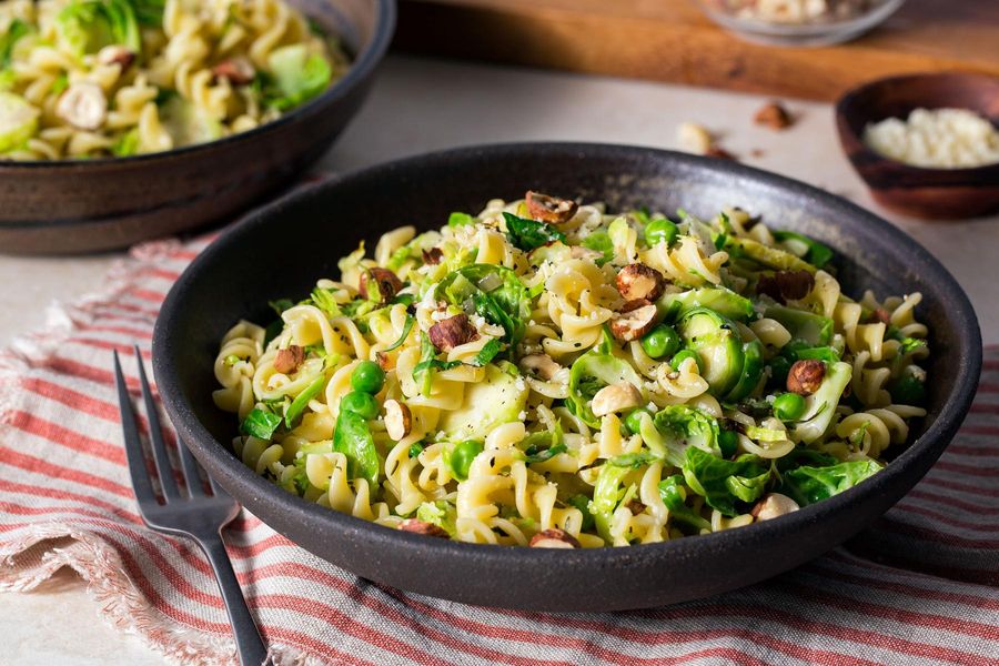 Brussels sprout carbonara with fusilli and roasted hazelnuts